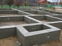 Устройство ленточных фундаментов и стен подвалов из бетонных блоков с приготовлением раствора и сборкой-разборкой опалубки