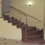 Комбинированная лестница из металла и кам